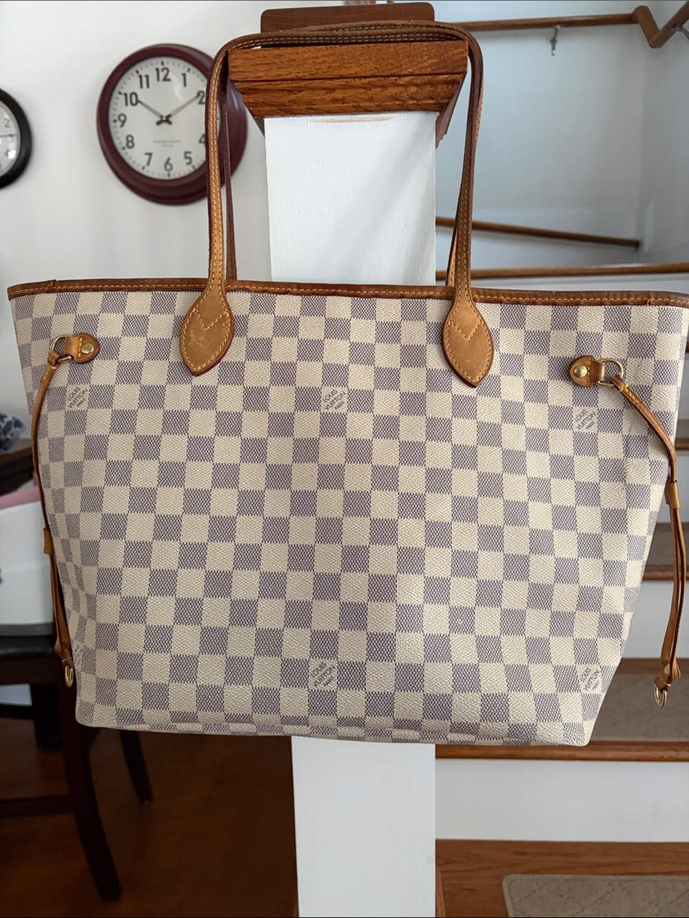 LV Neverfull MM. All straps intact. Pen and water marks as seen.